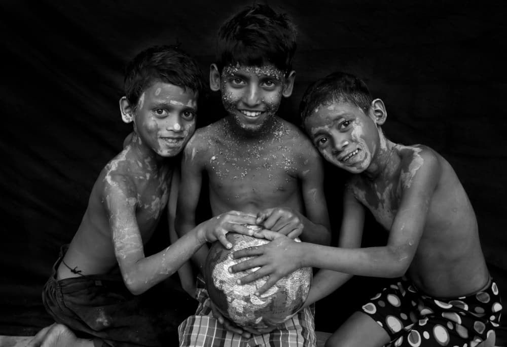 Happy Boys Holding Globe by Moumita Mondal — canvas wall art