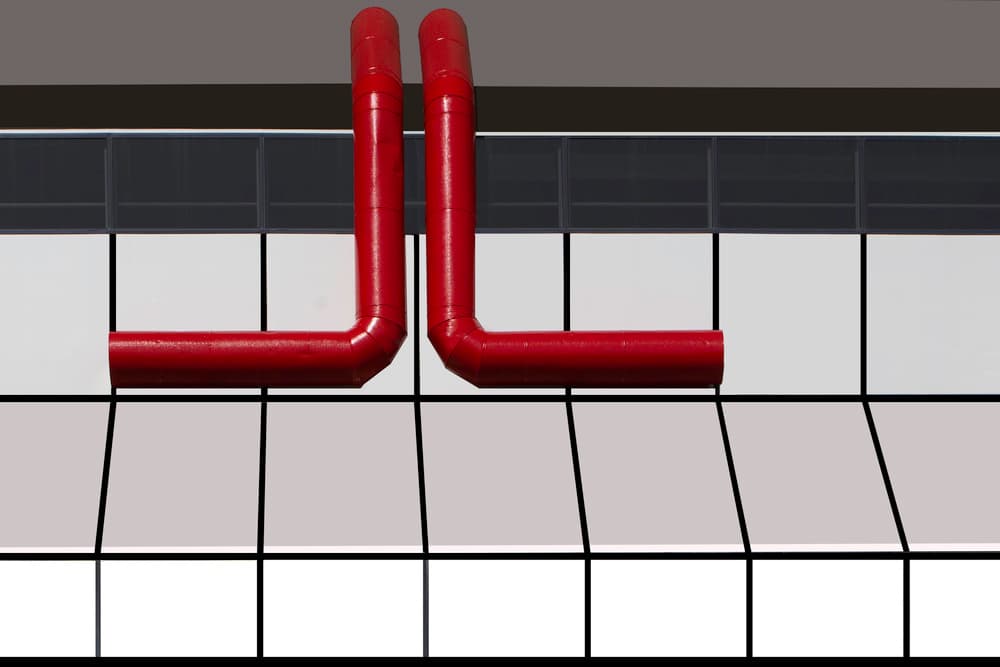 Bold Red Pipes by Jan Niezen — canvas wall art