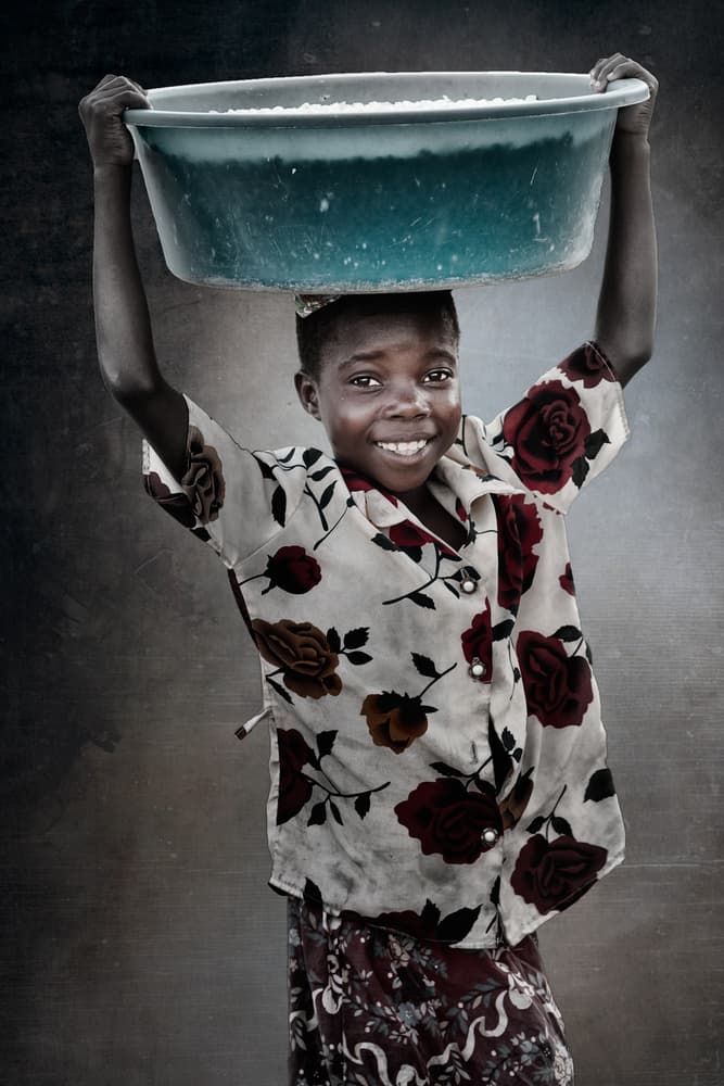 Smiling Girl Carrying Bowl by Antonio Grambone — canvas wall art