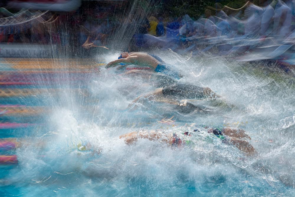 Swimmers Racing Splash by Milan Malovrh — canvas wall art