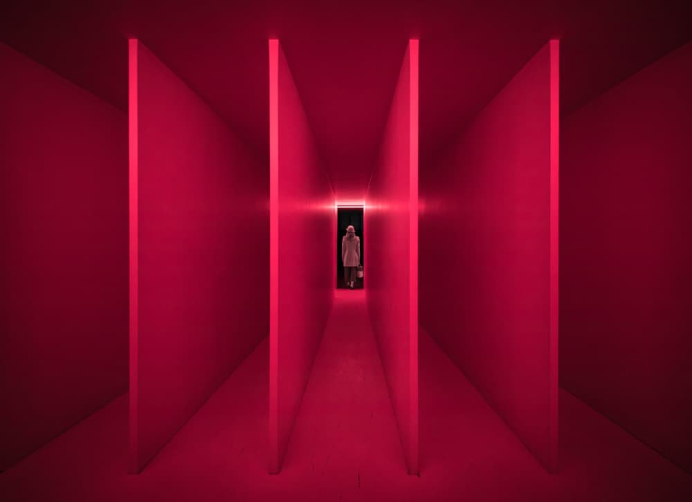 Lone Figure Red Hallway by Marco Tagliarino — canvas wall art