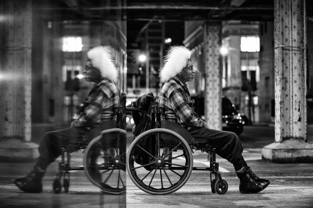 Urban Man Wheelchair Reflection by Goran Jovic — canvas wall art