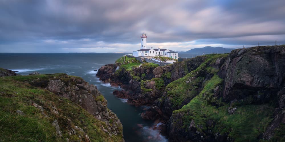 Dramatic Cliffside Lighthouse by Daniel Gastager — canvas wall art