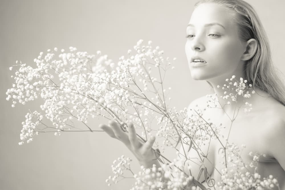 Woman with Baby's Breath by AURIMAS VALEVICIUS — canvas wall art