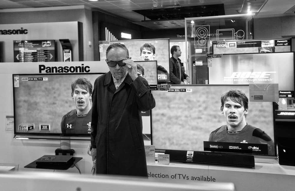 Man Watching Sports TV by Lorenzo Grifantini — canvas wall art