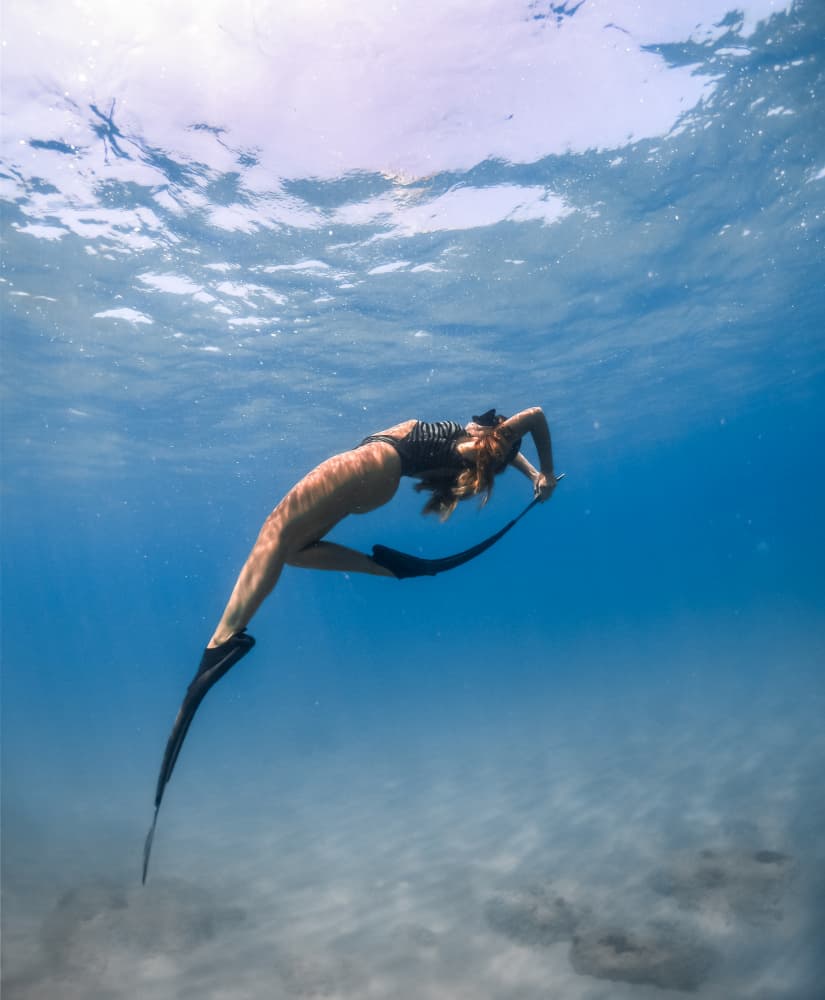 Graceful Underwater Dive by Hilal safarjalani — canvas wall art