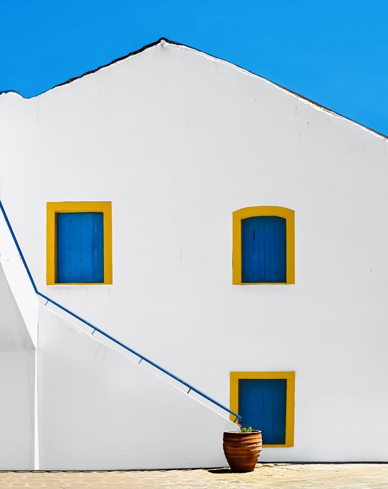 White Building Blue Windows by Arnon Orbach — canvas wall art