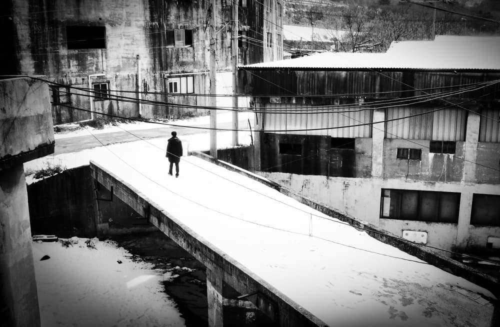 Lone Figure Winter Street by Mi Young Choi — canvas wall art