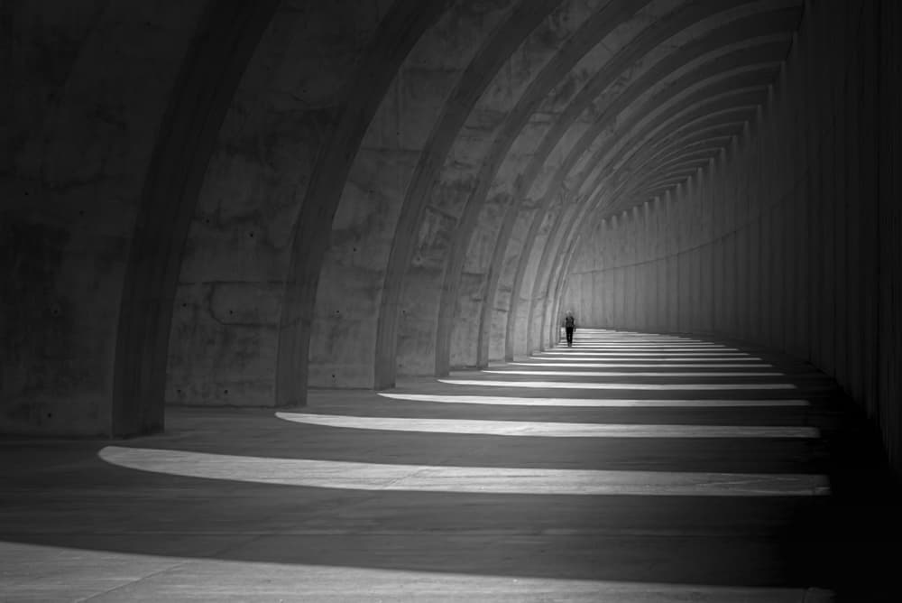 Lone Figure Arched Tunnel by Andy Dauer — canvas wall art