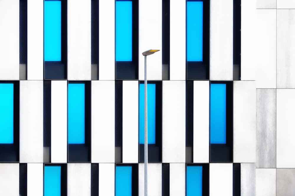 Geometric Blue Facade by Hans-Wolfgang Hawerkamp — canvas wall art