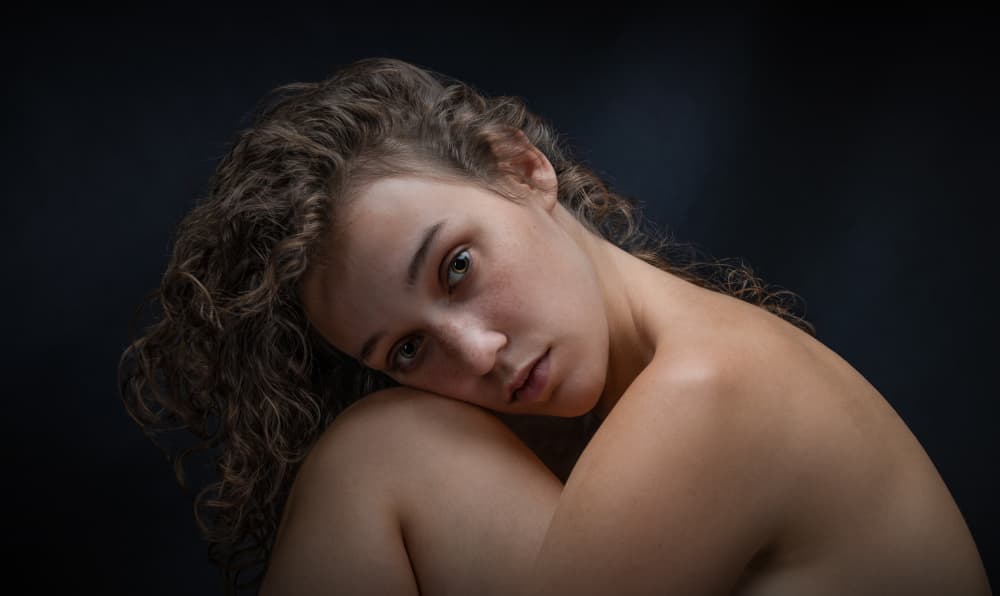 Pensive Young Woman by Luc Stalmans — canvas wall art
