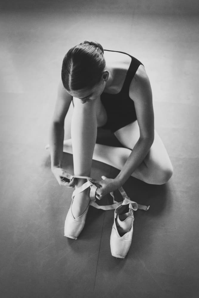 Ballerina Tying Pointe Shoes by Normunds Kaprano — canvas wall art