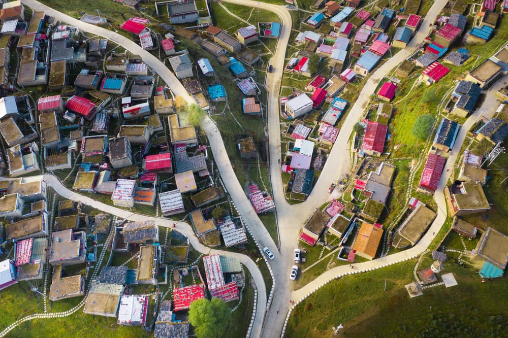 Colorful Hillside Village by Simoon — canvas wall art