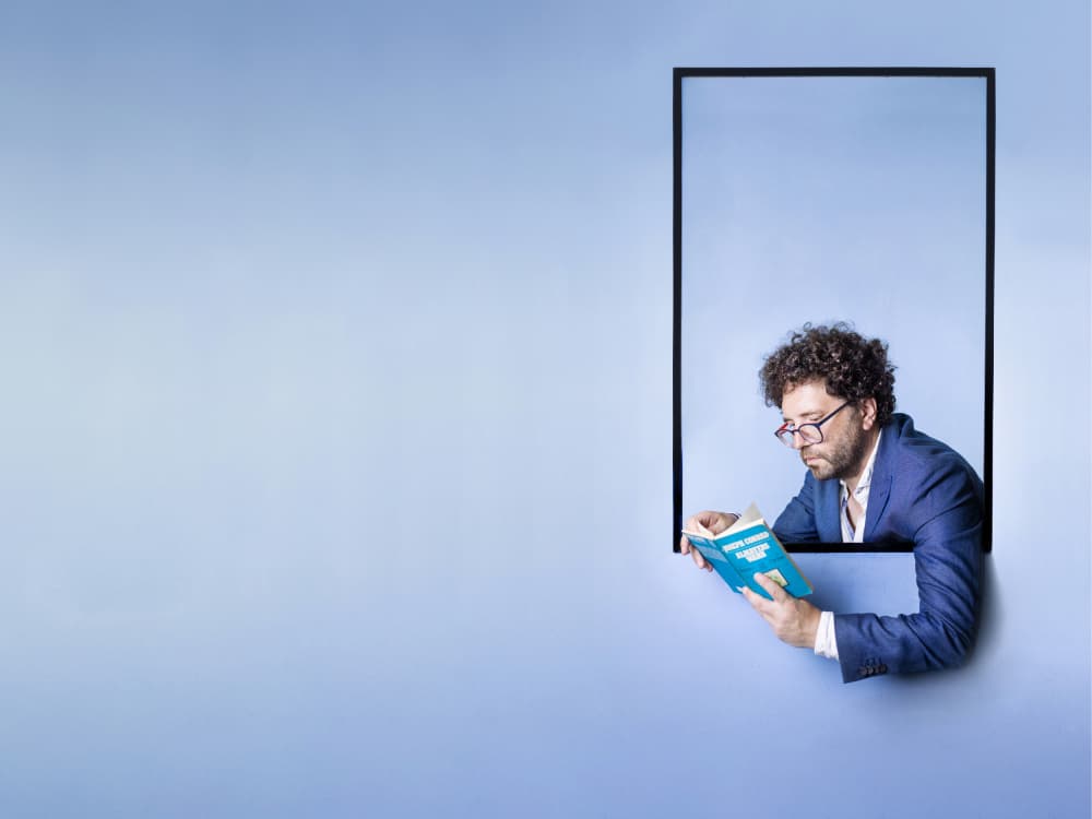 Man Reading in Blue by Michael Allmaier — canvas wall art
