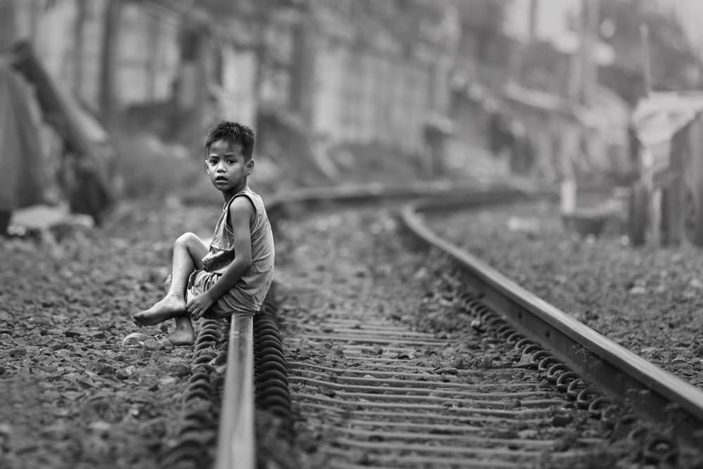 Pensive Boy On Tracks by Gunarto Song — canvas wall art