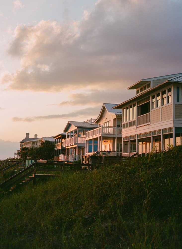 Coastal Sunset Homes by Bethany Young — canvas wall art