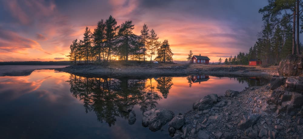 Red Cabin Lake Reflection by Ole Henrik Skjelstad — canvas wall art