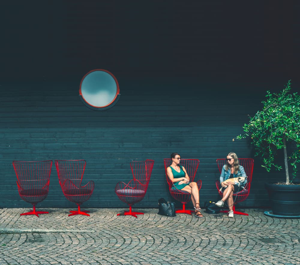 Friends On Red Chairs by Alex Ogazzi — canvas wall art
