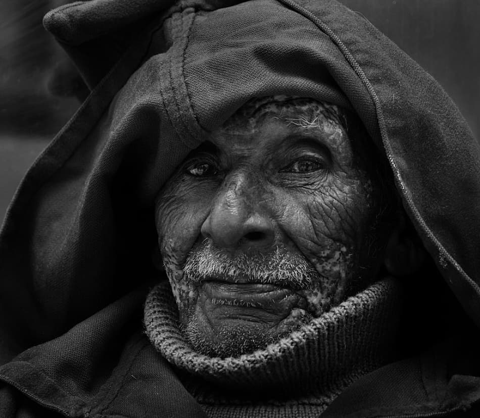 Hooded Elder Portrait by Lou Urlings — canvas wall art