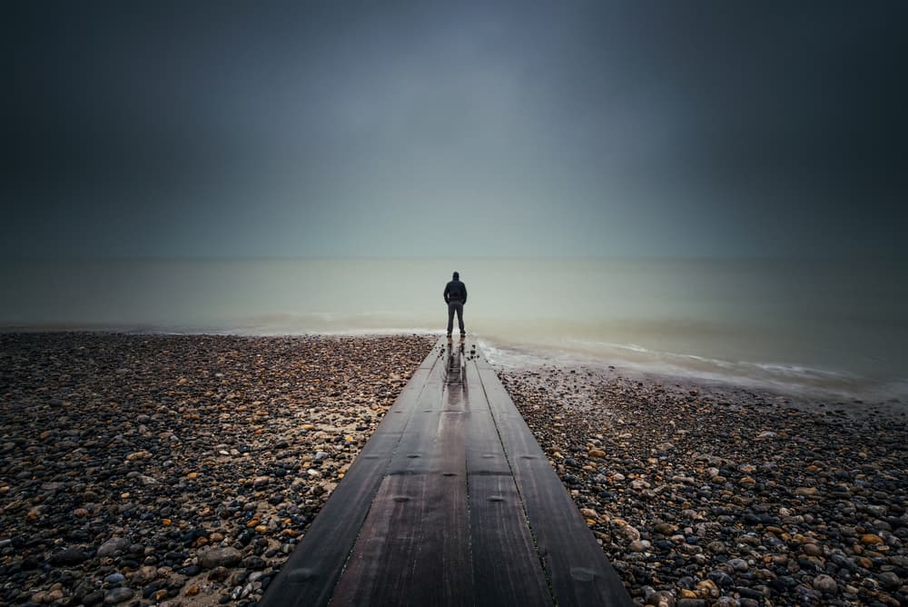 Lone Figure Calm Ocean by Christophe Staelens — canvas wall art