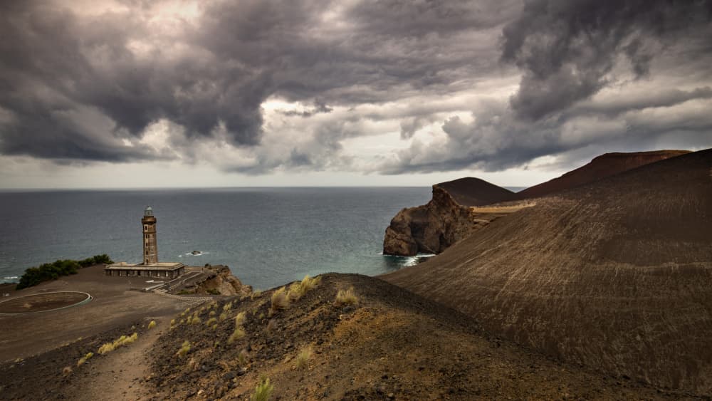 Lighthouse Under Stormy Skies by Gonçalo Capitão — canvas wall art
