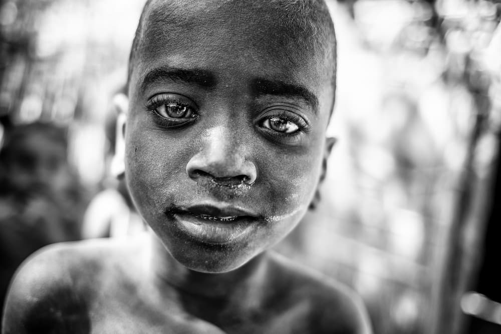 Young Boy Deep Gaze by Marco Tagliarino — canvas wall art