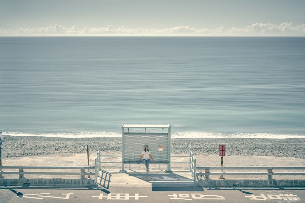 Girl At Ocean Bus Stop by MingLun Tsai (蔡明倫) — canvas wall art