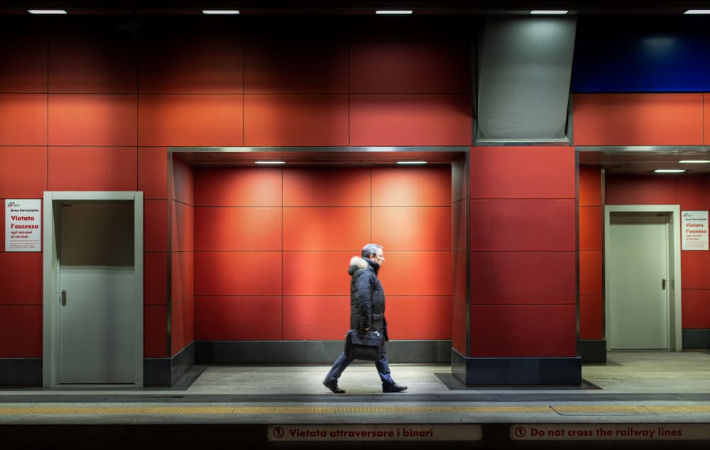 Man Walking Red Metro by Giorgio Toniolo — canvas wall art