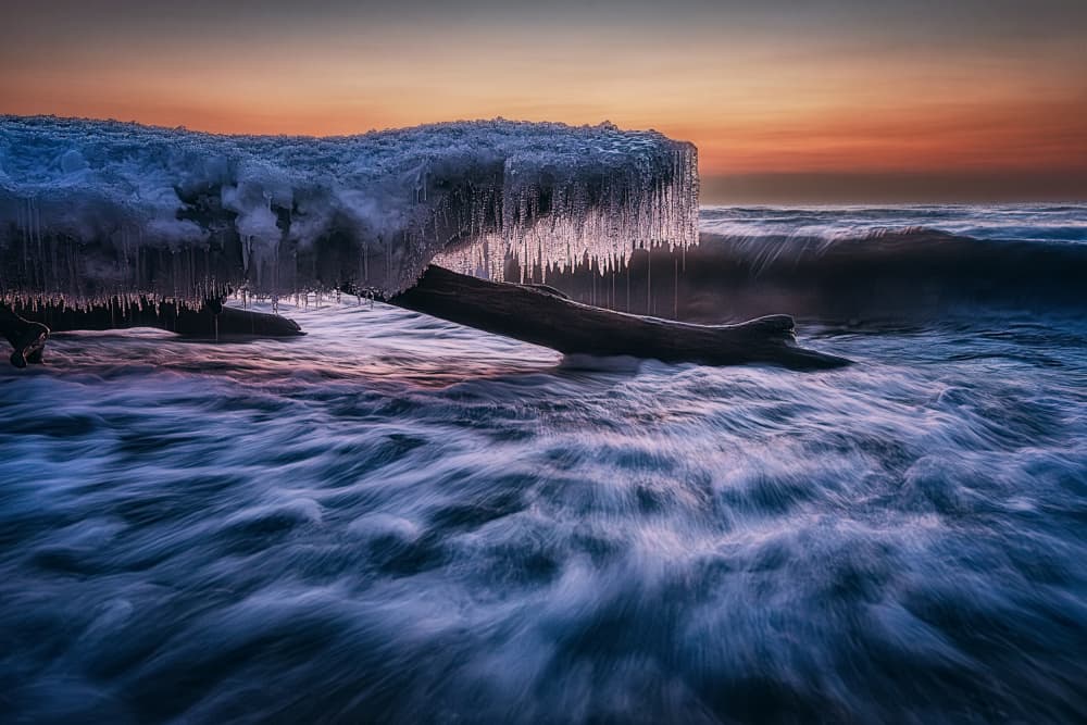 Icy Shoreline Sunset by Ben.C.L — canvas wall art
