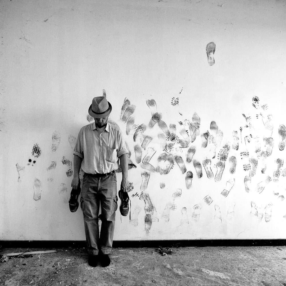 Man and Footprint Wall by Carlo Ferrara — canvas wall art