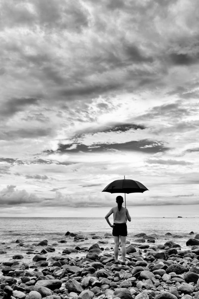 Solitary Woman Beach Umbrella by Kieron Long — canvas wall art