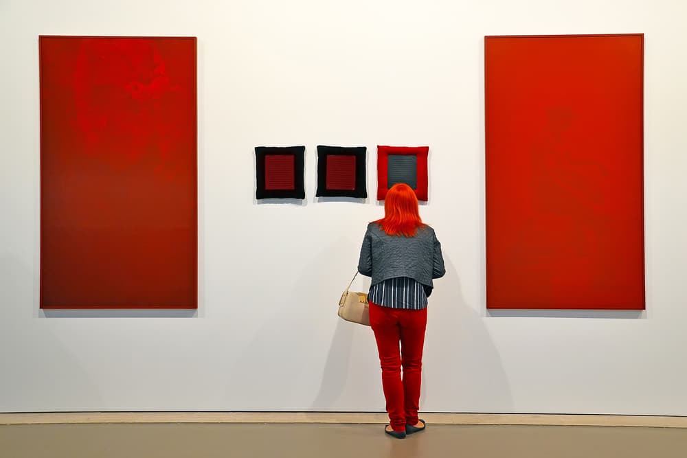 Woman Viewing Red Art by Josefina Melo — canvas wall art