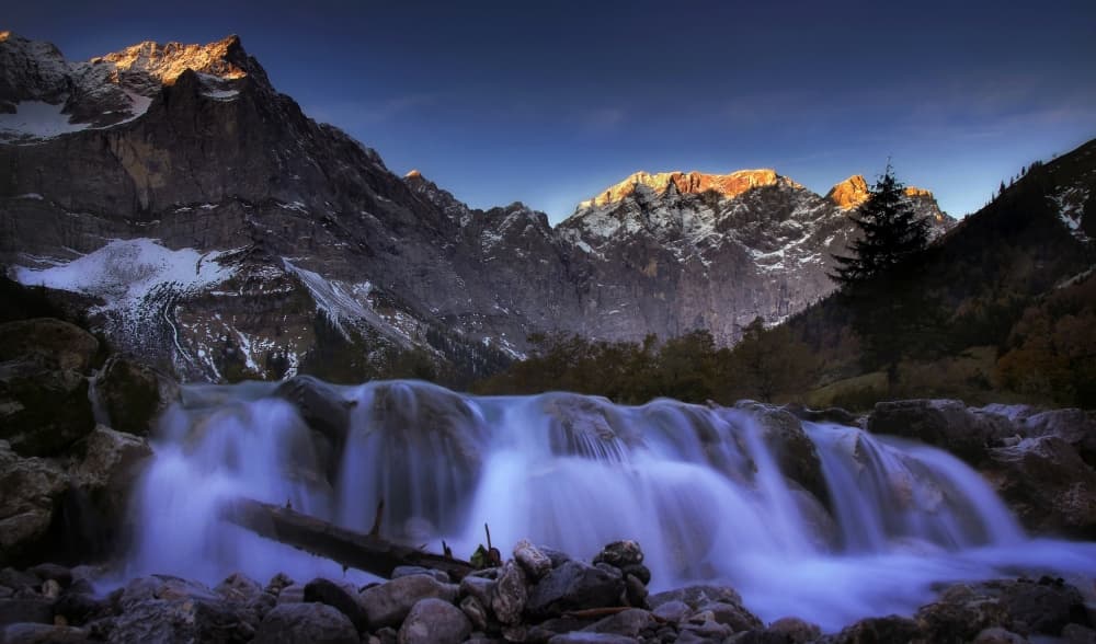 Golden Peaks Waterfall by Norbert Maier — canvas wall art