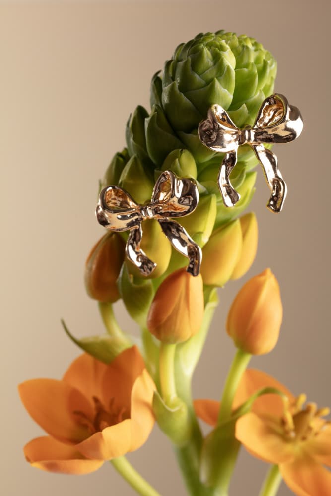 Golden Bows on Bloom by Julia Ramiro — canvas wall art