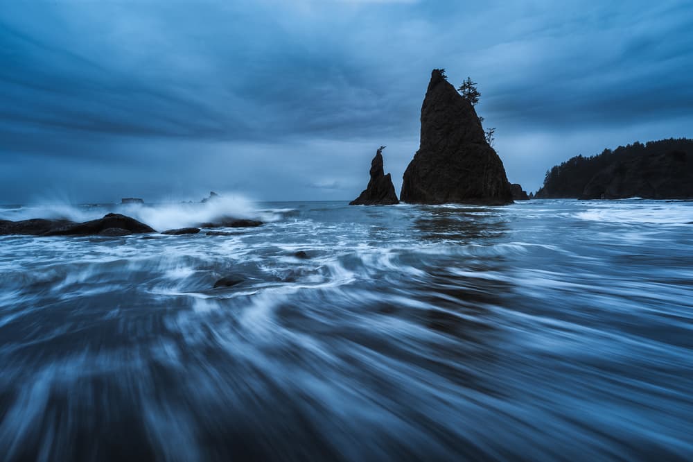 Moody Blue Sea Stacks by Yimei Sun — canvas wall art