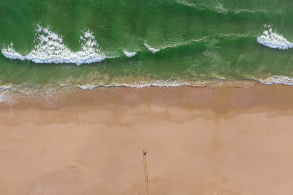 Emerald Waters Sandy Beach by Haitham AL Farsi — canvas wall art