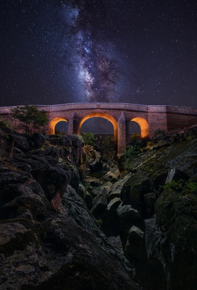 Milky Way Stone Bridge by Enrique Rodriguez de Mingo — canvas wall art