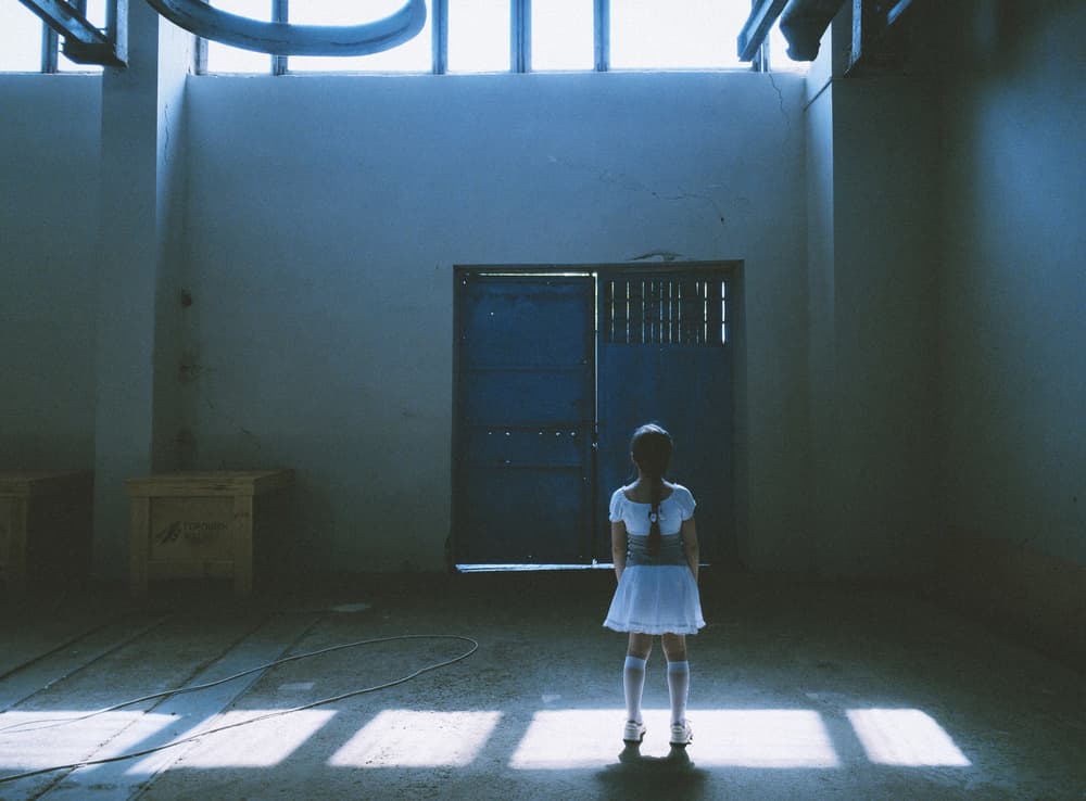 Solitary Girl Blue Door by Karina Aleksandrova — canvas wall art