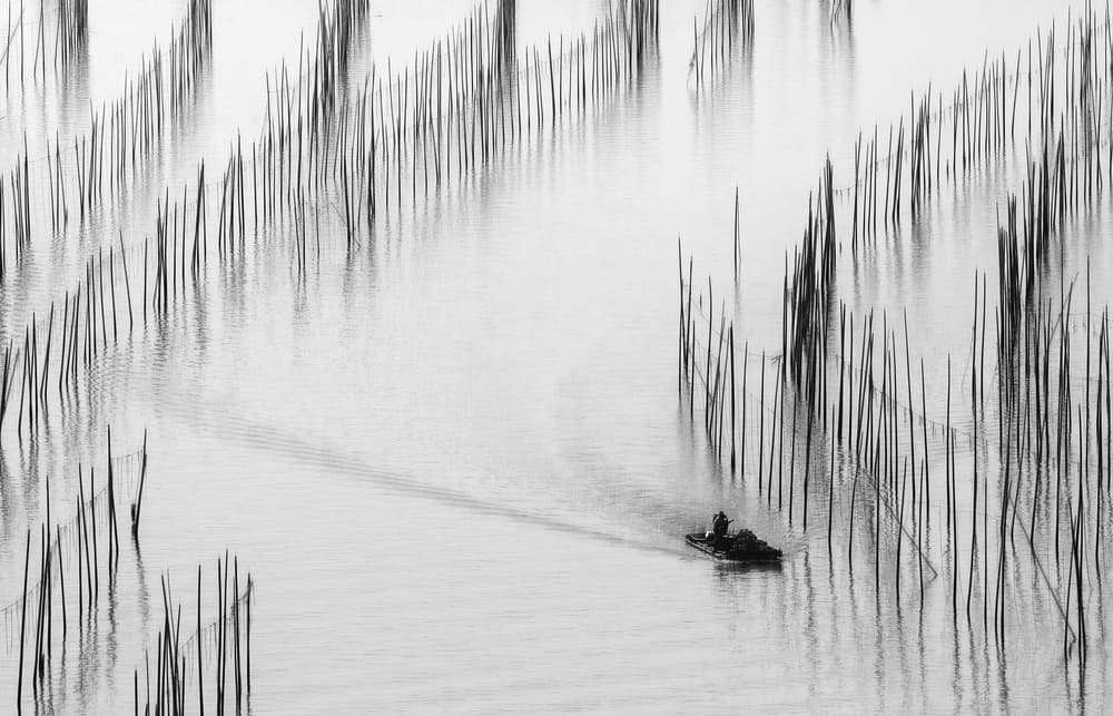 Fisherman Among Water Poles by ADIREK M — canvas wall art