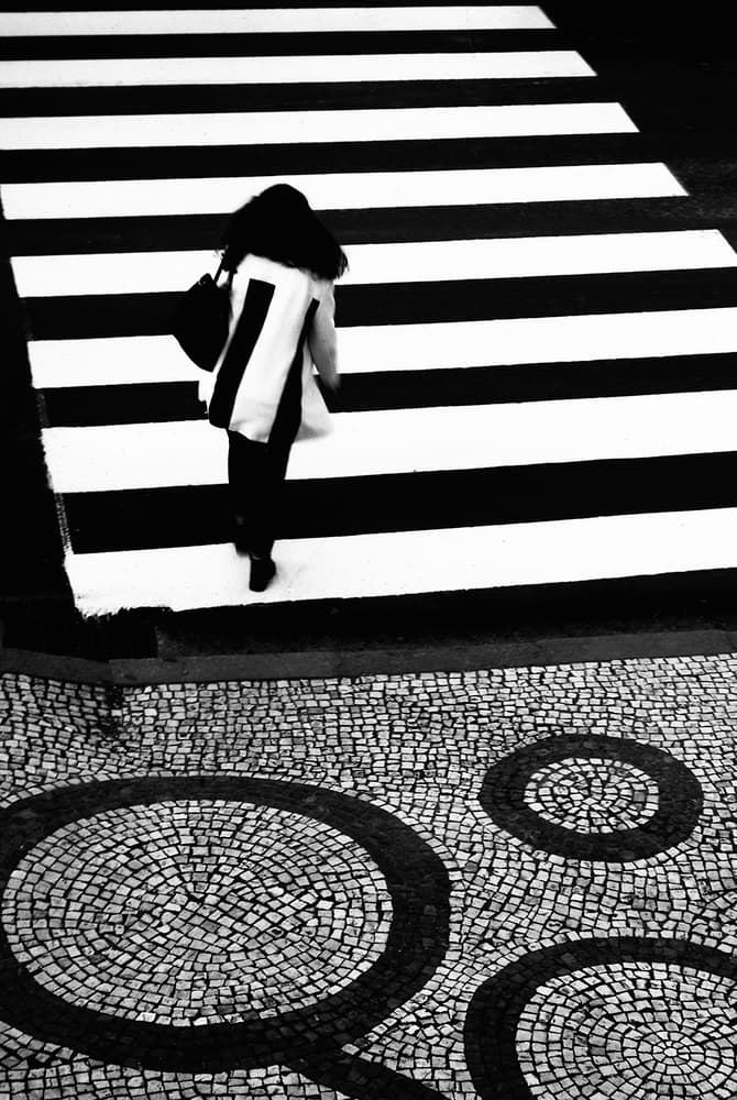 Woman Crossing Geometric Street by Paulo Abrantes — canvas wall art