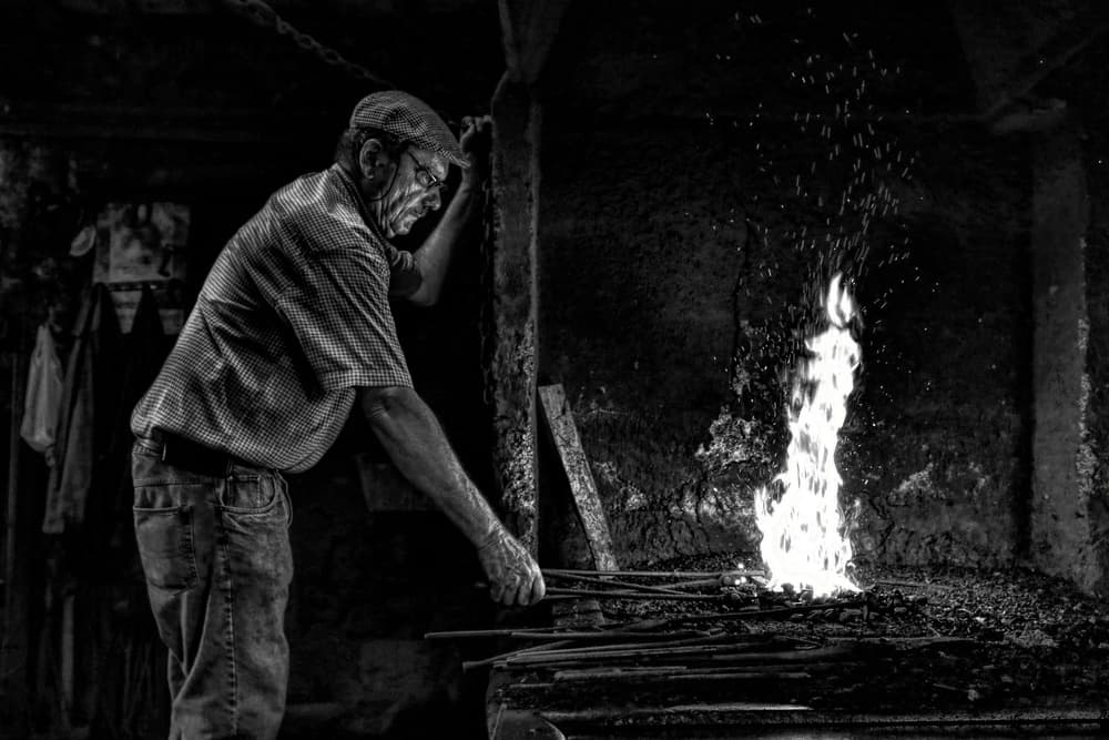 Blacksmith Working Fire by Paulo Medeiros — canvas wall art