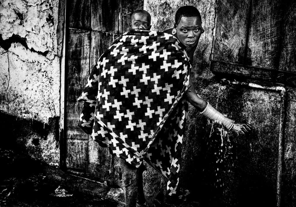 African Mother Child Water by Joxe Inazio Kuesta Garmendia — canvas wall art