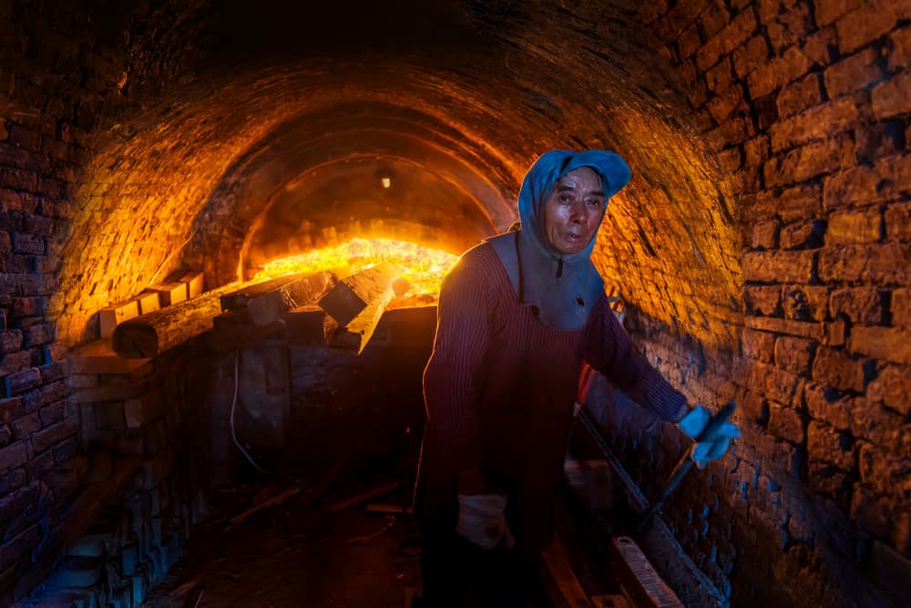 Woman at Fiery Kiln by Irene Wu — canvas wall art