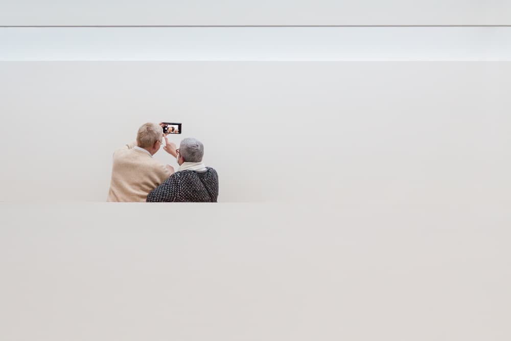 Senior Couple Shared Screen by Michelle Degryse — canvas wall art