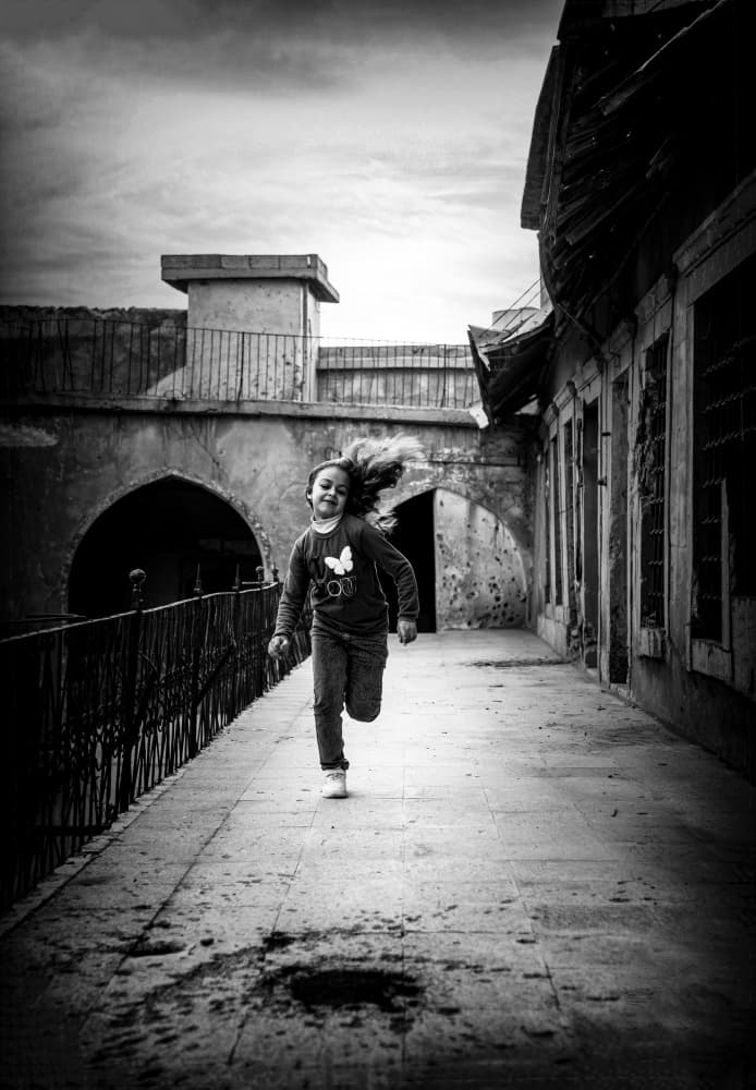 Joyful Child Running by Jalili — canvas wall art