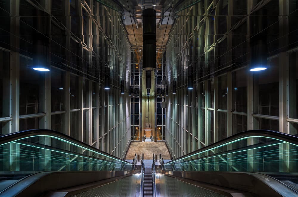 Sleek Escalator Reflections by Sus Bogaerts — canvas wall art