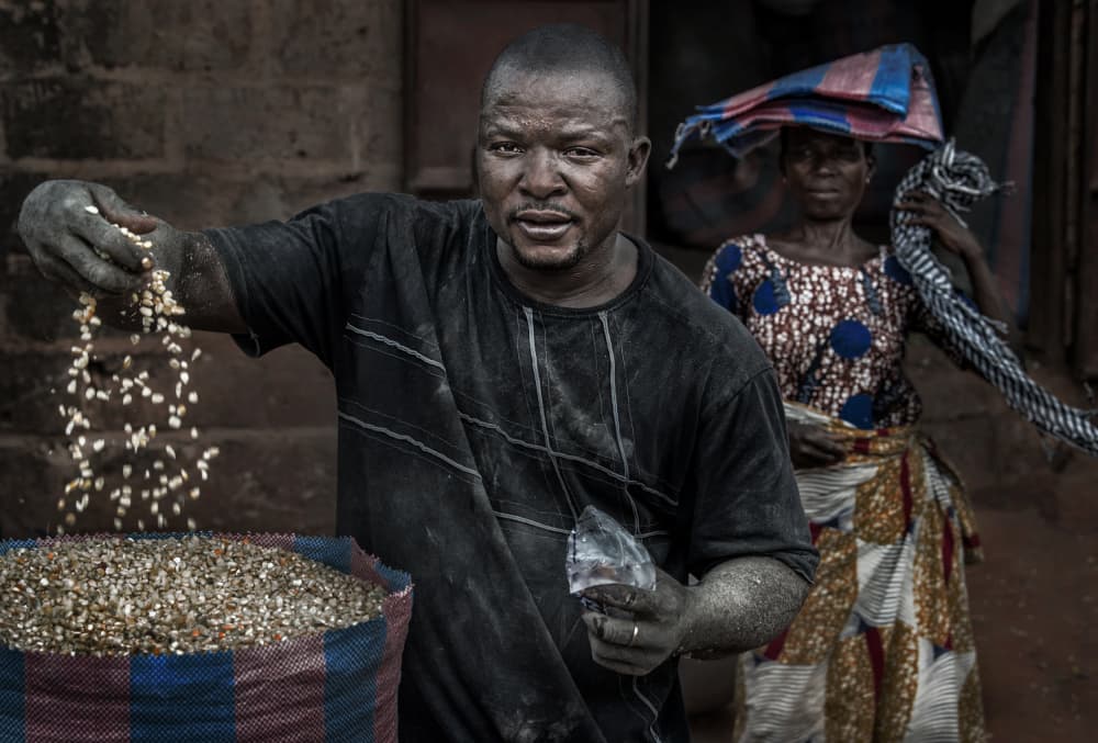 African Grain Vendor by Joxe Inazio Kuesta Garmendia — canvas wall art
