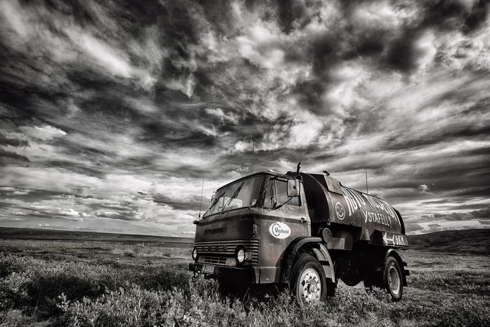 Old Truck Under Dramatic Sky by Þorsteinn H. Ingibergsson — canvas wall art