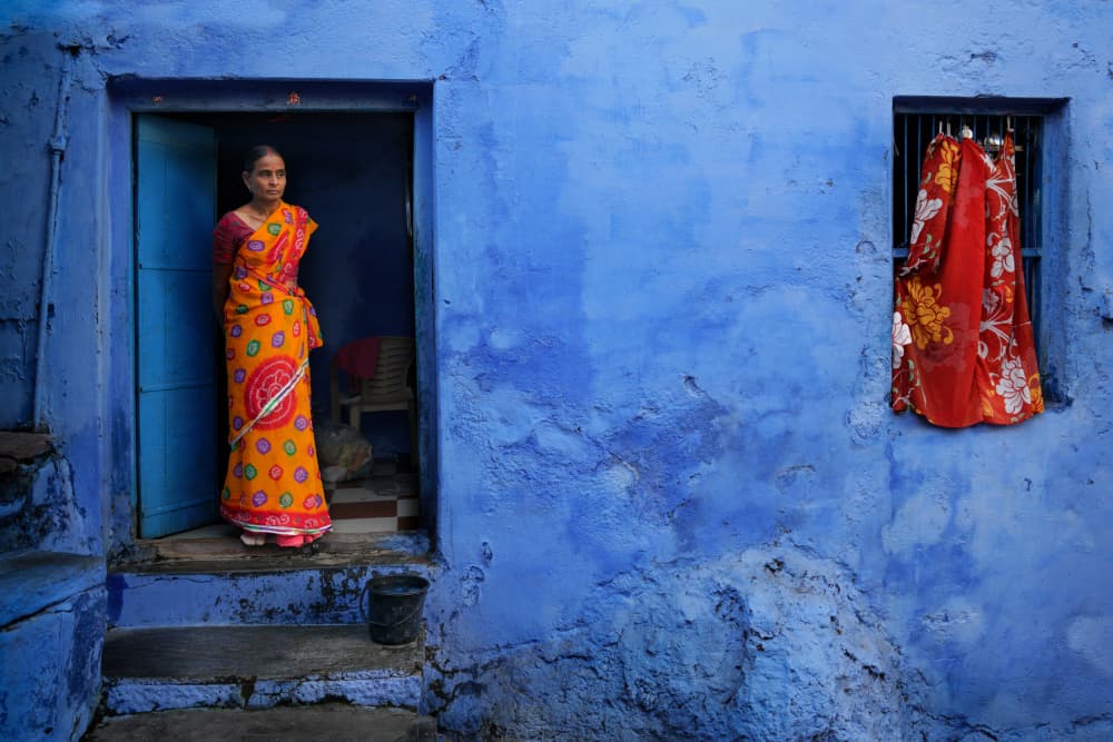 Orange Saree Blue Wall by Tommaseo Gregorio — canvas wall art