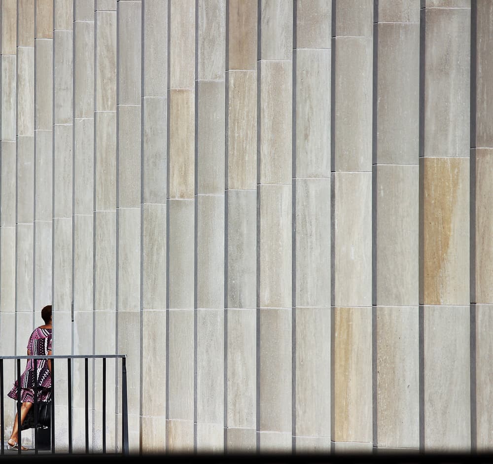 Woman Against Geometric Wall by Jian Wang — canvas wall art